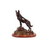 A large bronze study of a German shepherd dog, on rockwork base, after L. Carvin, 14cm high