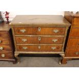 An 18th Century walnut and cross-banded chest on stand, fitted three long drawers, raised on