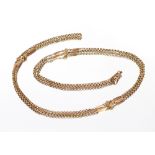 A long 9 carat gold guard chain, comprising various heavy links, approx. 33.5gms
