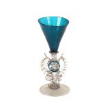 An Antique blue and clear glass Venetian goblet, raised on circular spread foot, 15.5cm high; and
