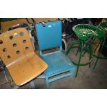 A blue leather upholstered chair
