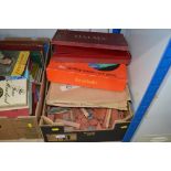 A box of various games and wooden building blocks