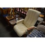 A cream upholstered swivel office chair