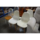 Four plastic dining chairs