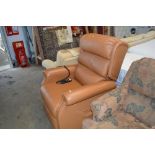 A rise and recline brown leather armchair