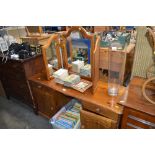 A pine dressing table with triptych mirror