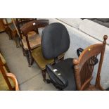 A black upholstered swivel office chair