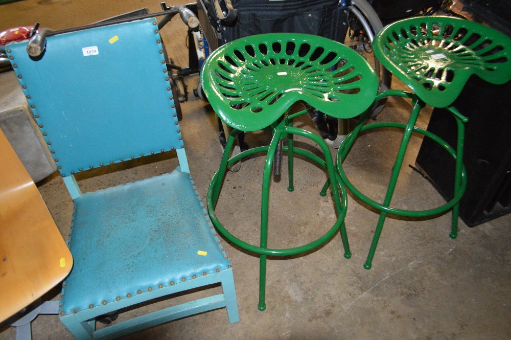 A tractor seat stool (55)