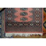 An approx. 2'9" x 2' eastern patterned rug