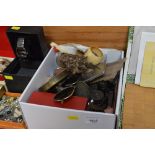 A box of various items to include military binocul