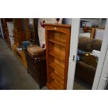 A pine open fronted bookcase