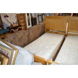 A pine singled bed frame with Sound Sleep mattress