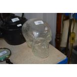 A glass skull (80)