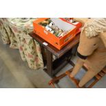 An oak side table with magazine rack to base