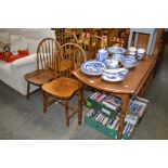 A drop leaf table; together with a set of four sti