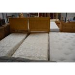 A pine single bed frame with Sound Sleep mattress