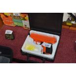 A BB gun in fitted case (?)