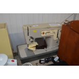 A Singer electric sewing machine sold as collector