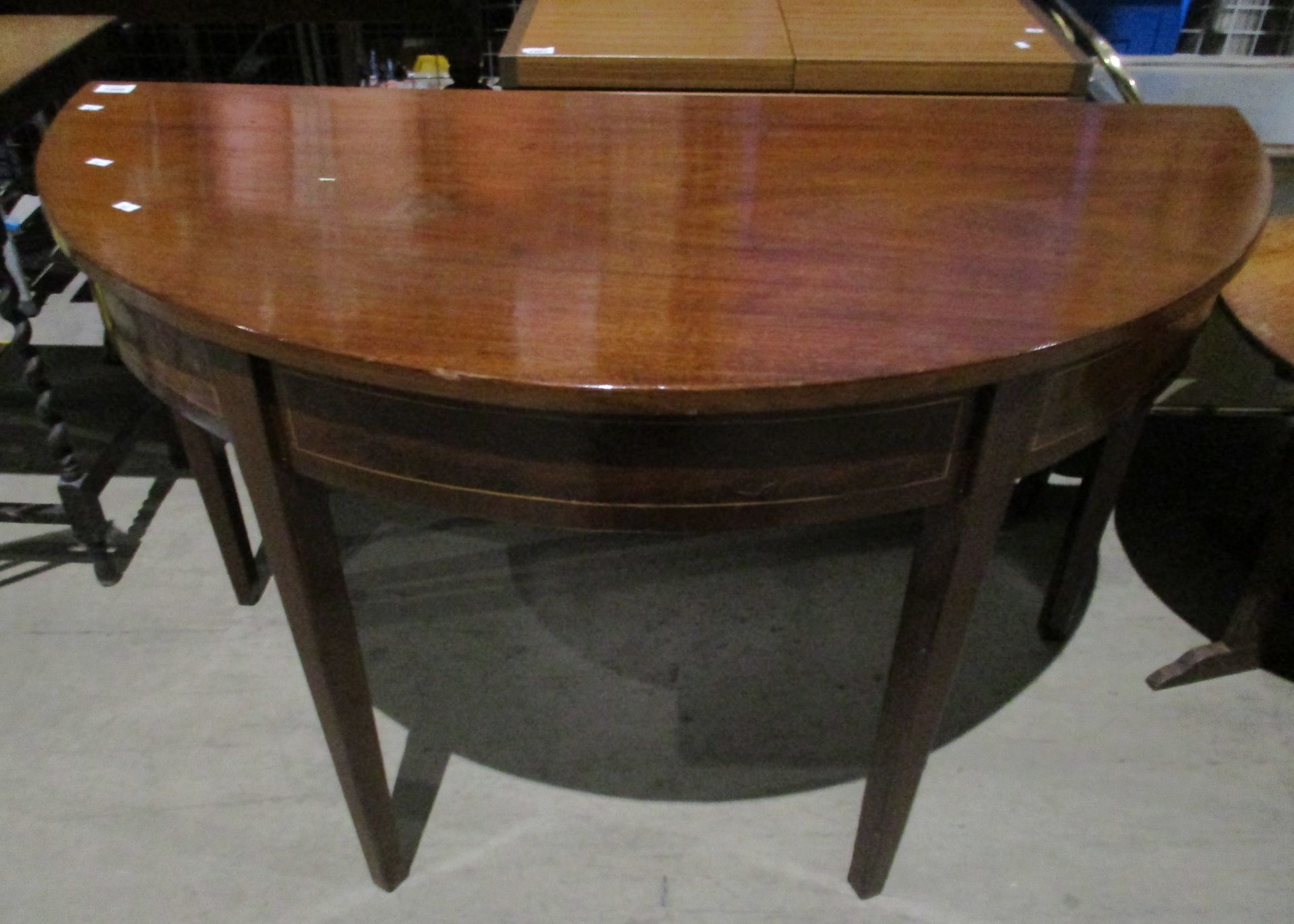 A mahogany half moon side table,