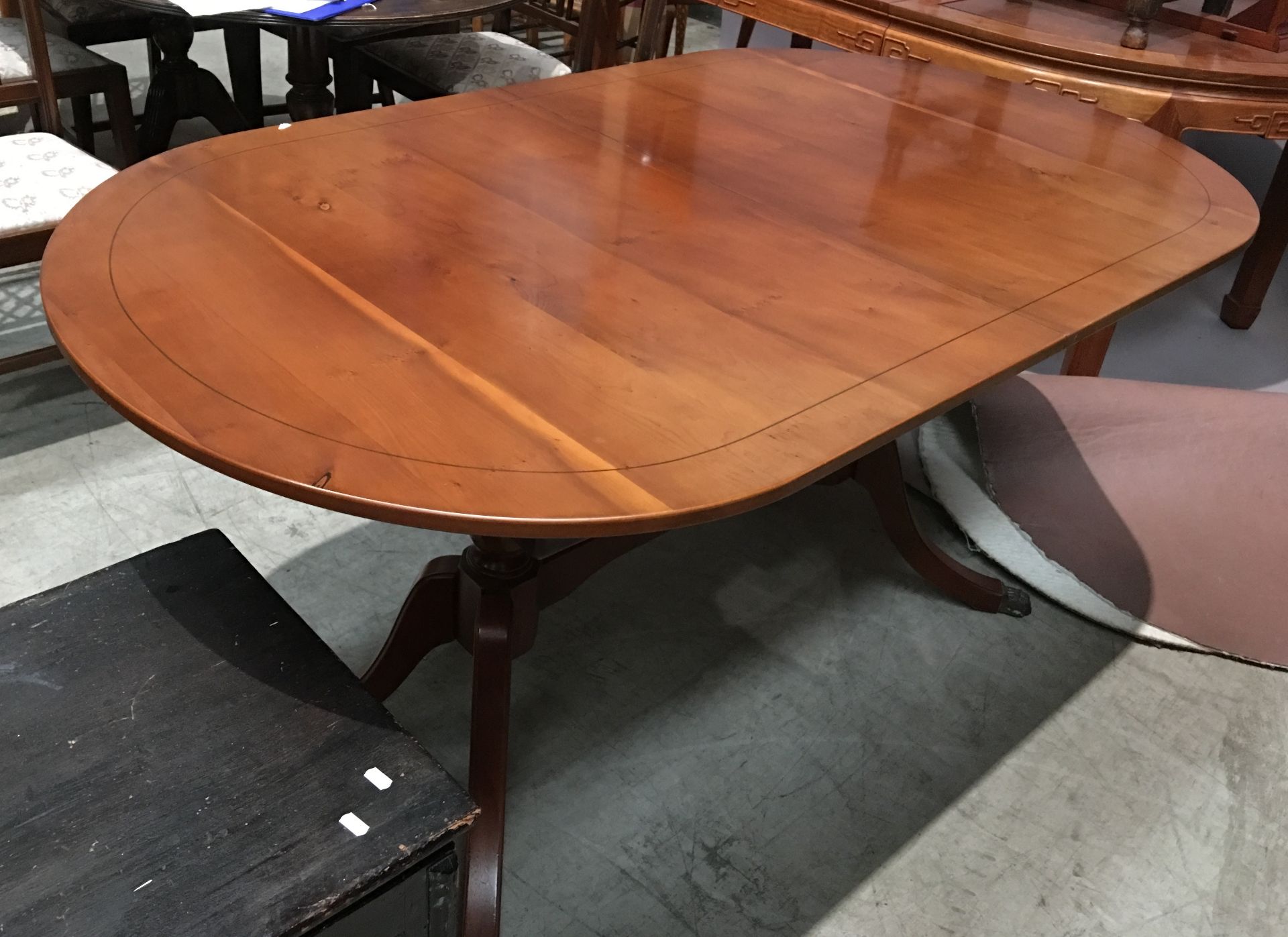 A yew D-ended dining table,