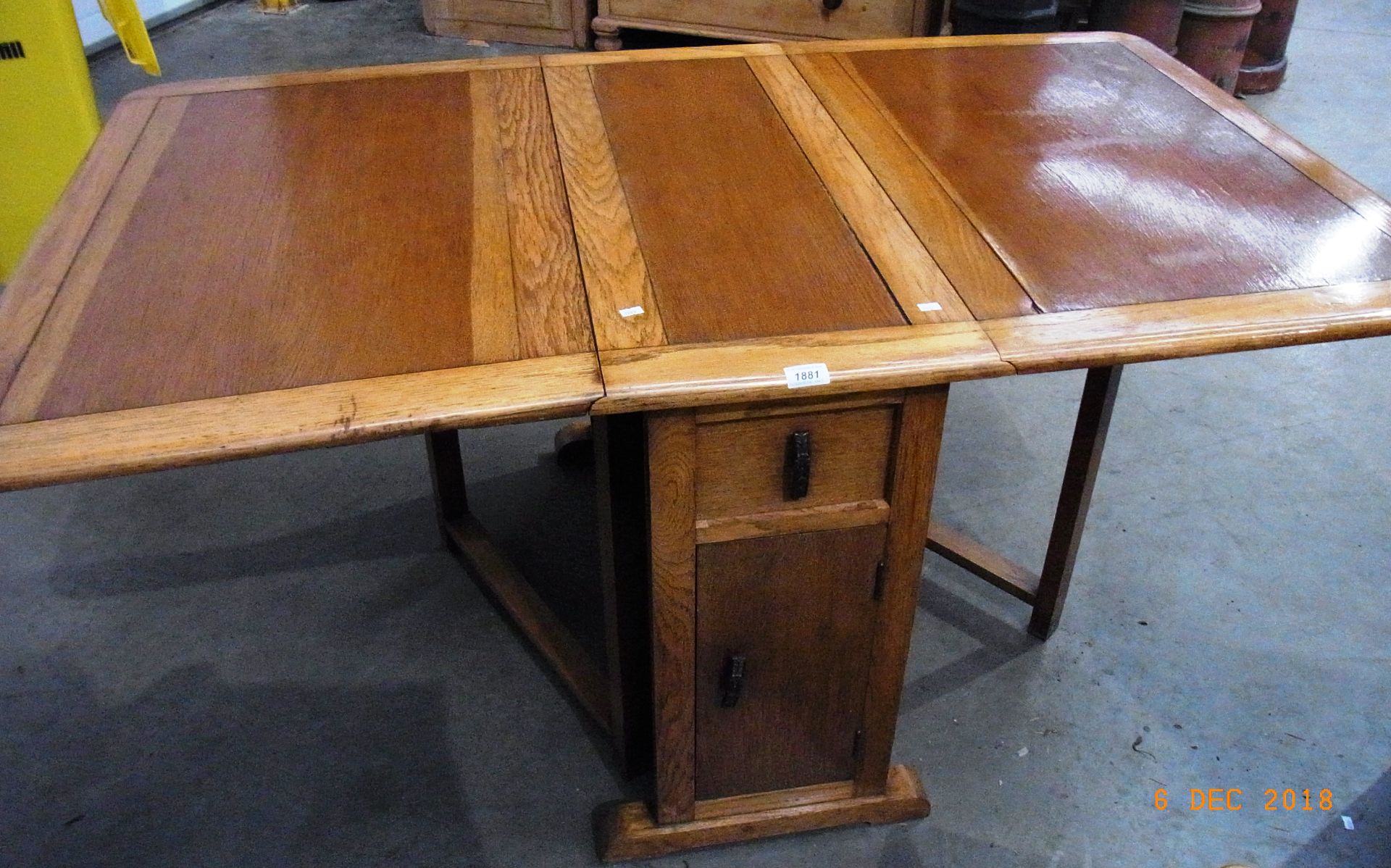 Oak drop leaf dining table with fitted cupboard and drawers to pillars 5'2" x 3' extended