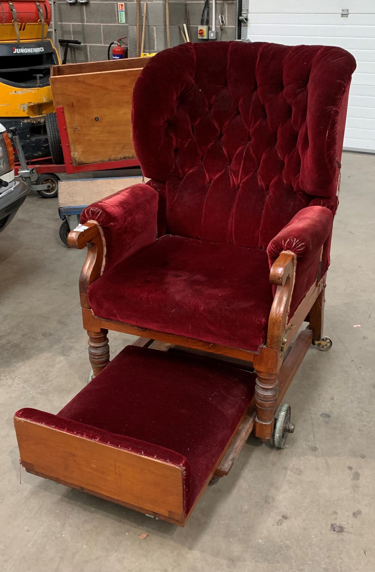A Victorian invalid chair recovered in red velvet raised on brass wheels and labelled Leveson and - Image 4 of 6