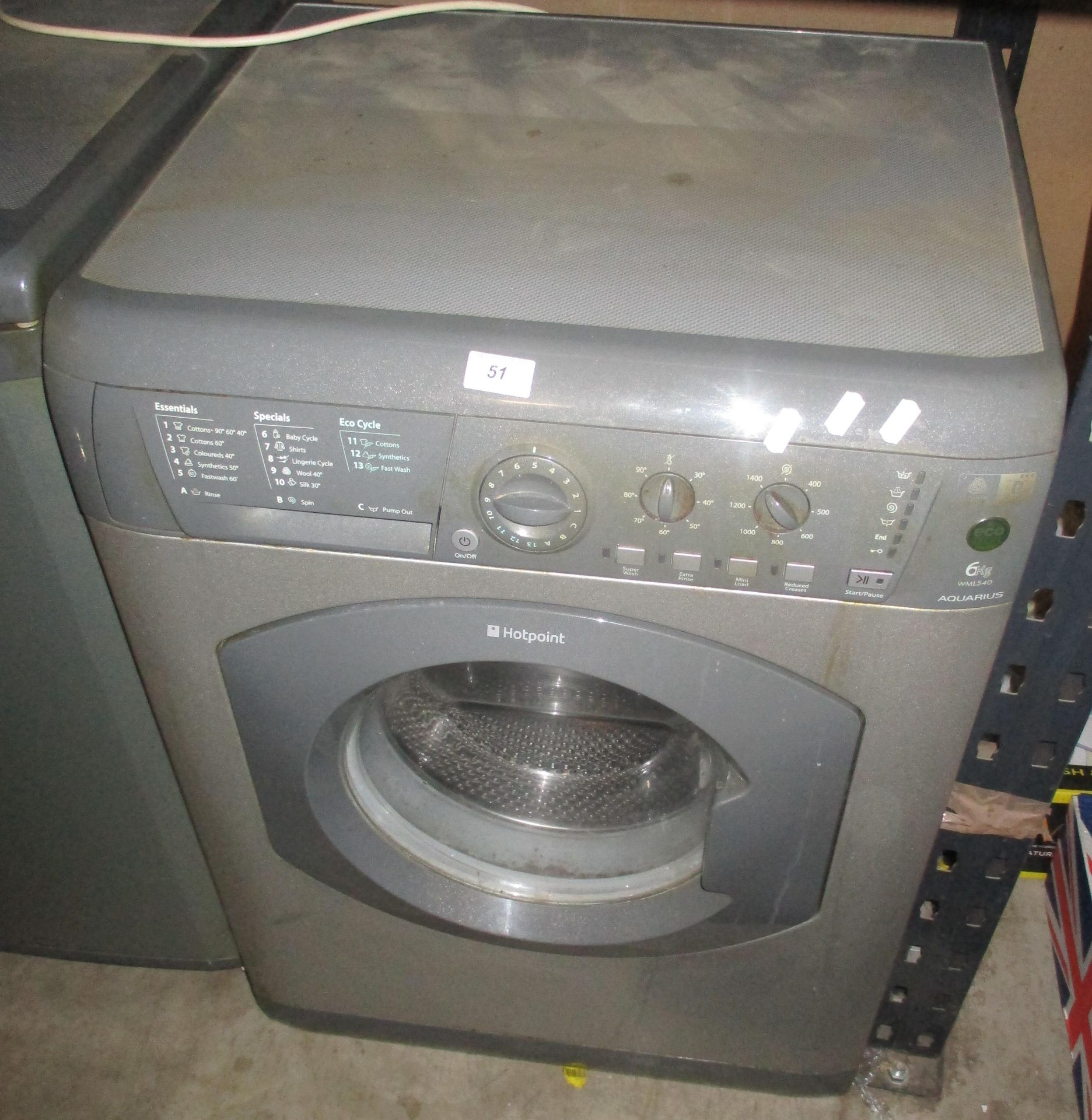 A Hotpoint Aquarius silver washing machine