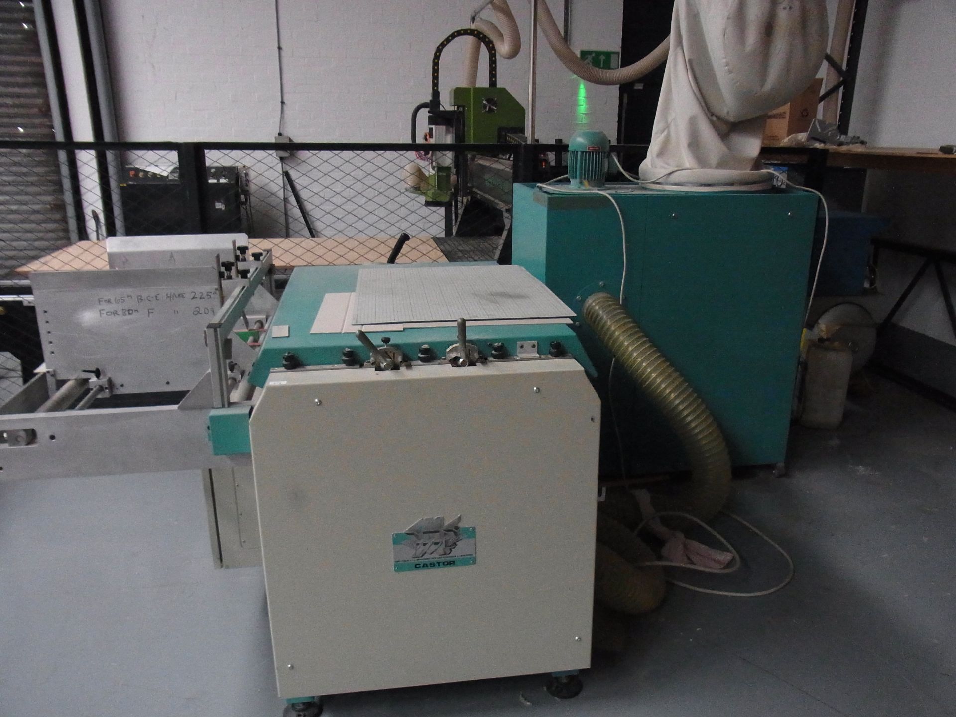 CMC Castor cardboard grooving machine with single dust bag extraction system and extension table
