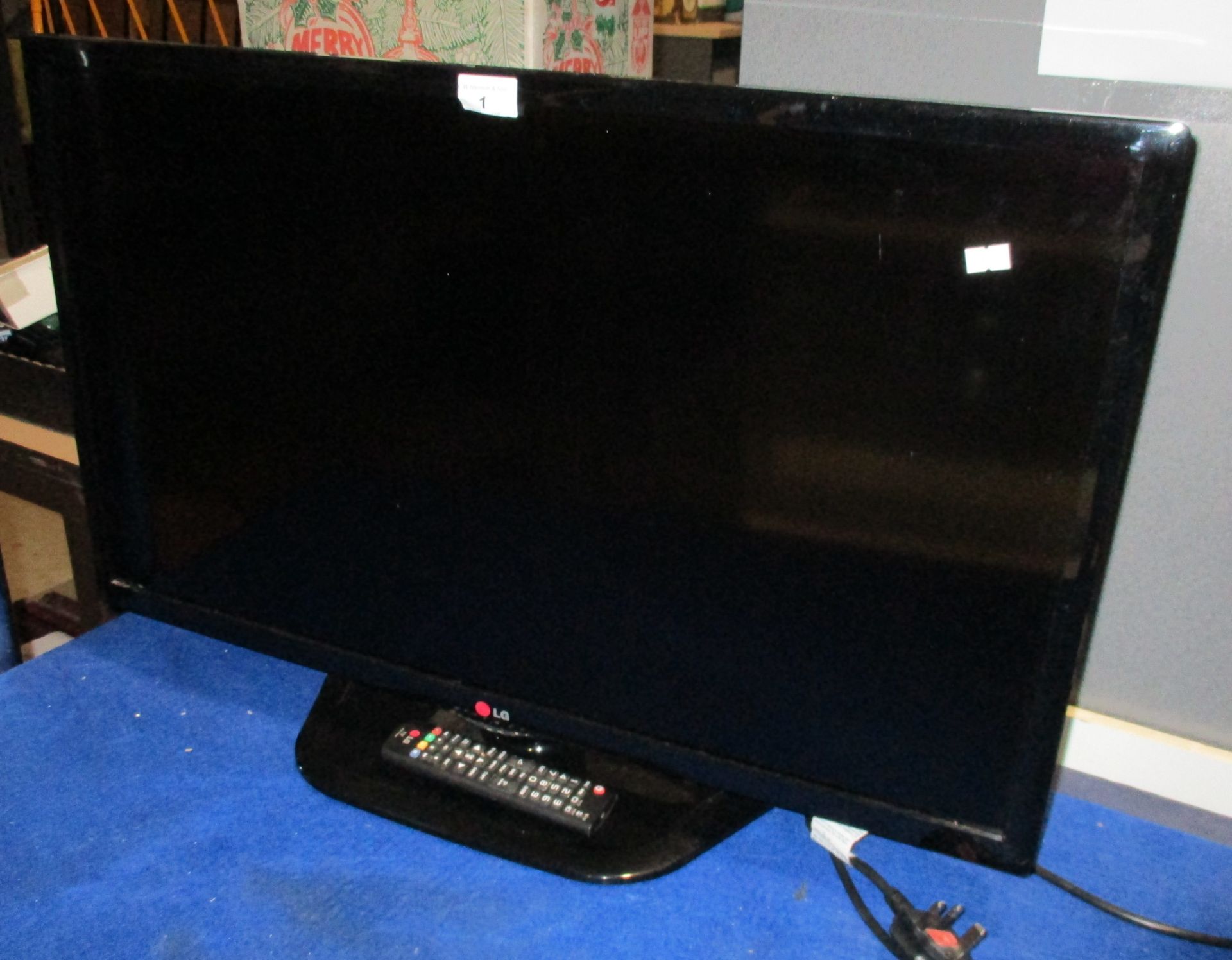 An LG 32 LN540U 32" LCD television complete with remote control