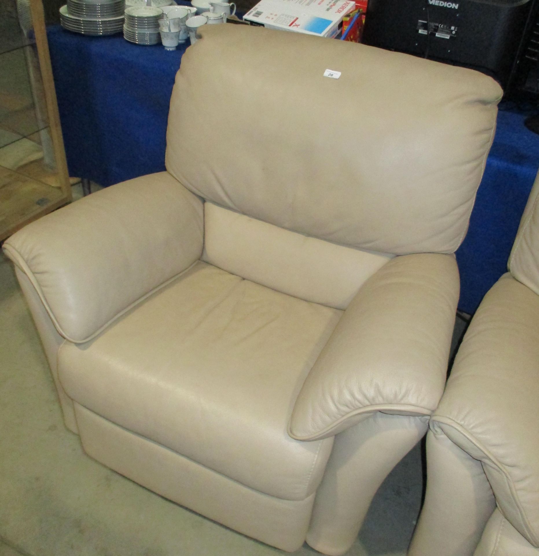 Tan leather swivel rocking armchair