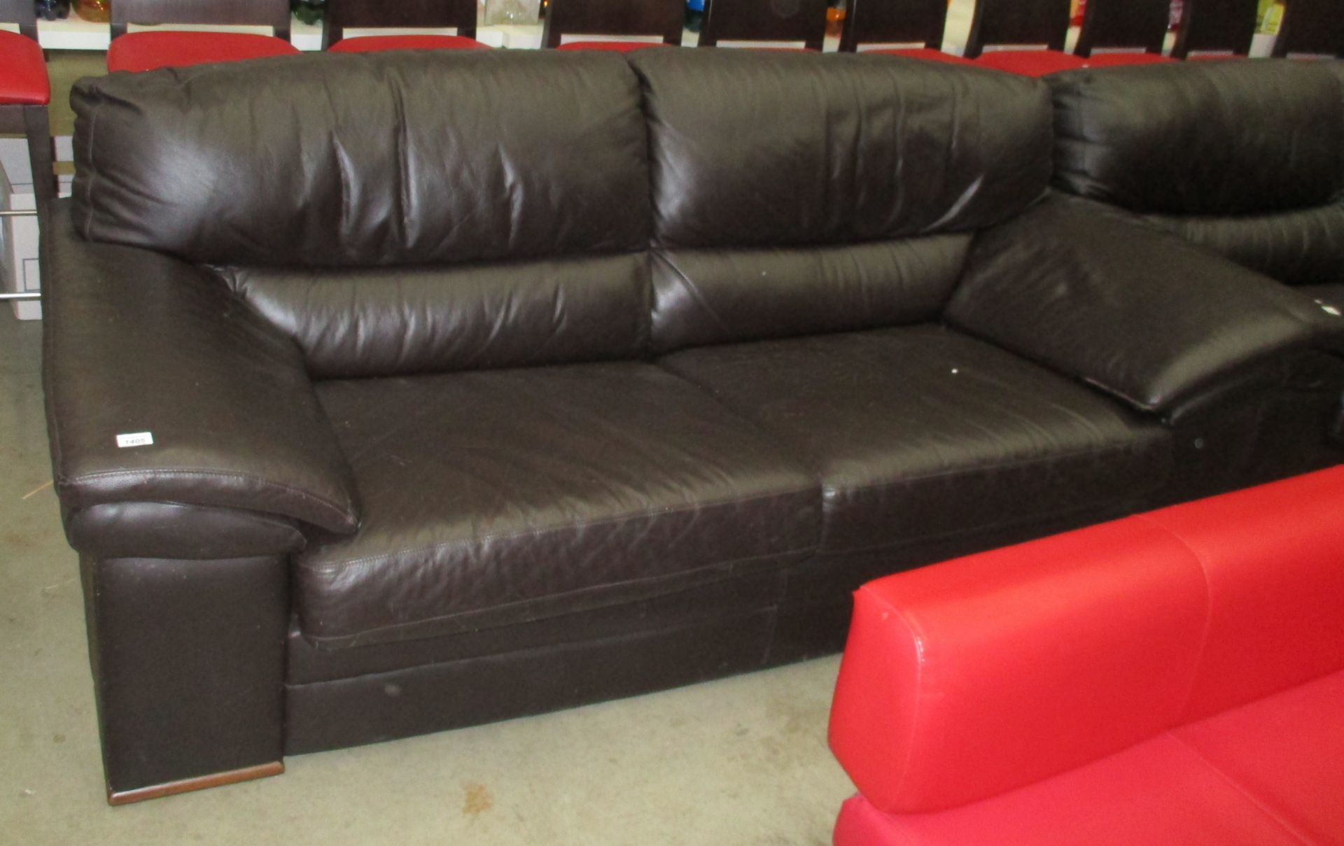 A dark brown leather 3 seater settee - light markings