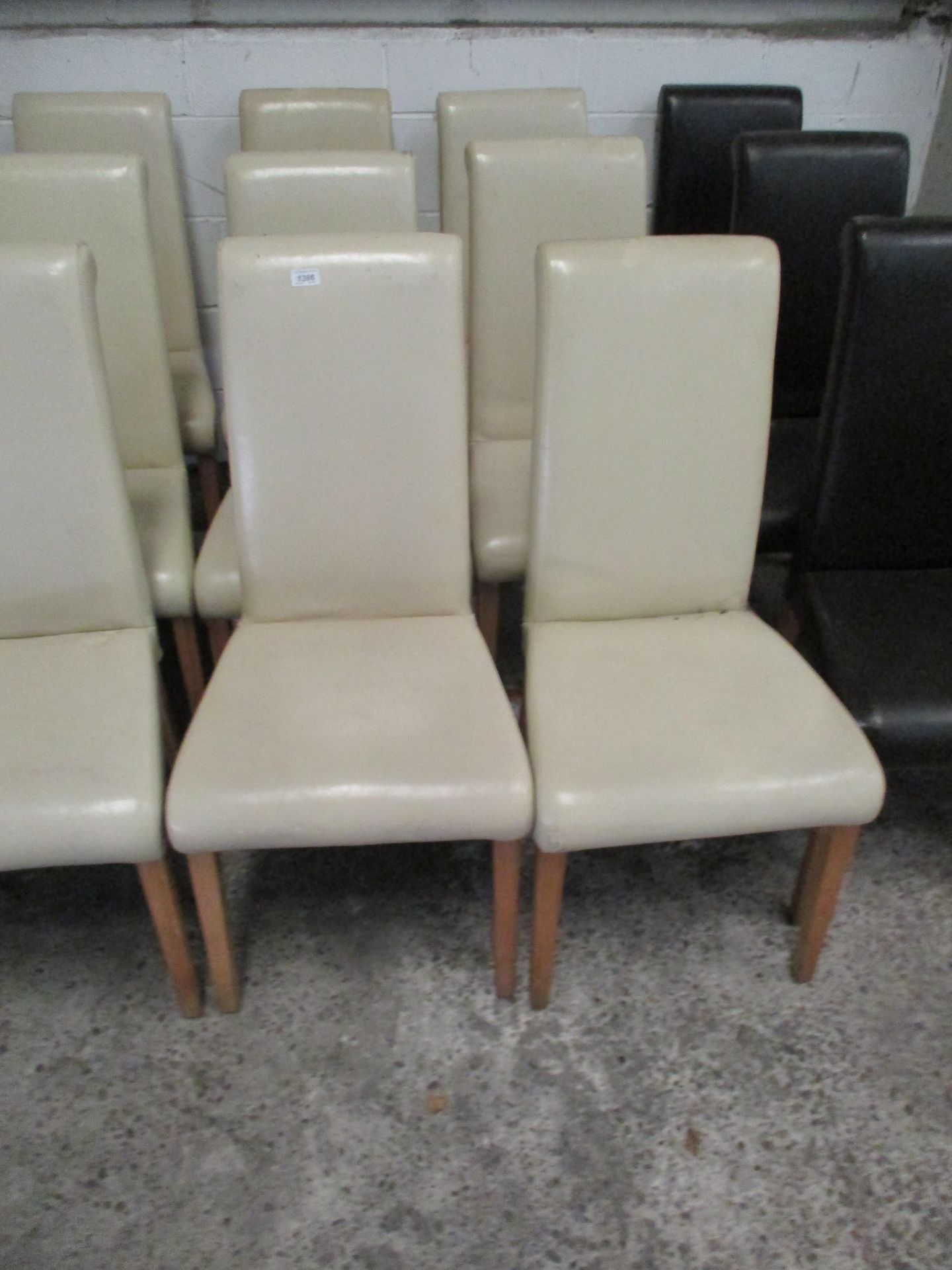 6 x cream leather upholstered high back dining chairs on light wooden feet