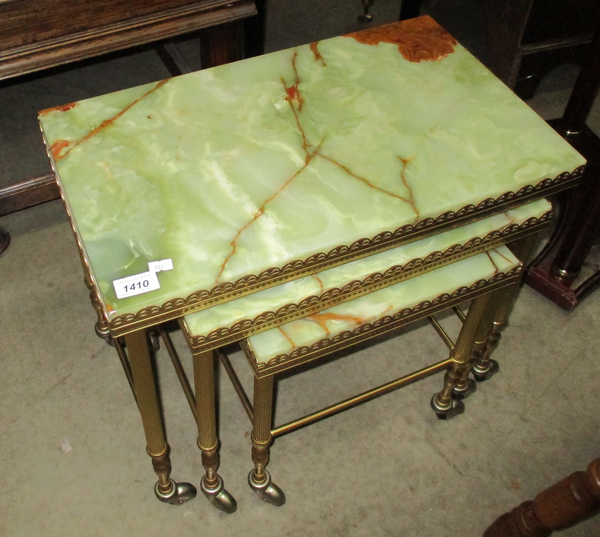 A gilt framed mobile nest of 3 coffee tables with green patterned onyx tops