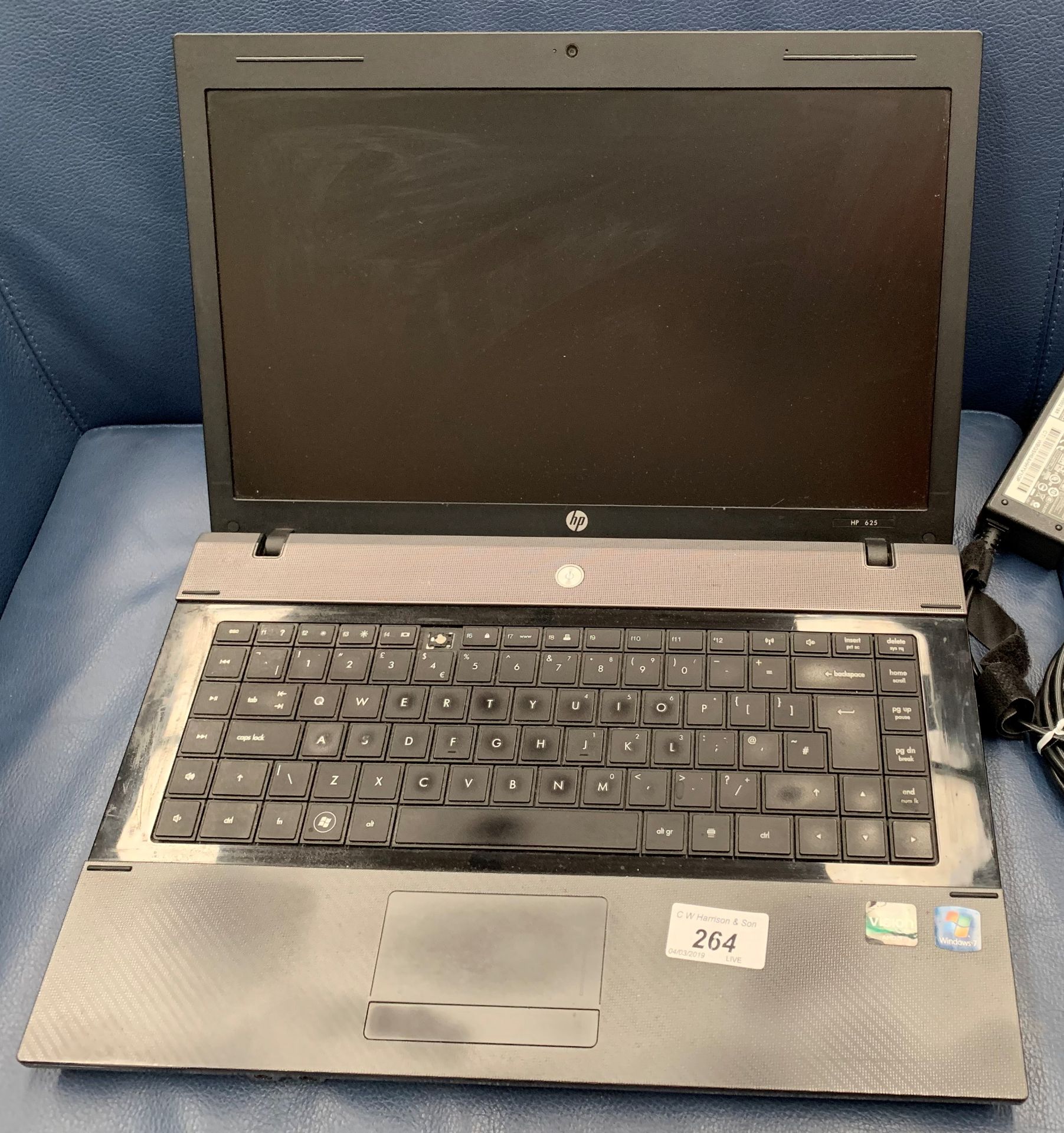 An HP 625 laptop computer with power adaptor