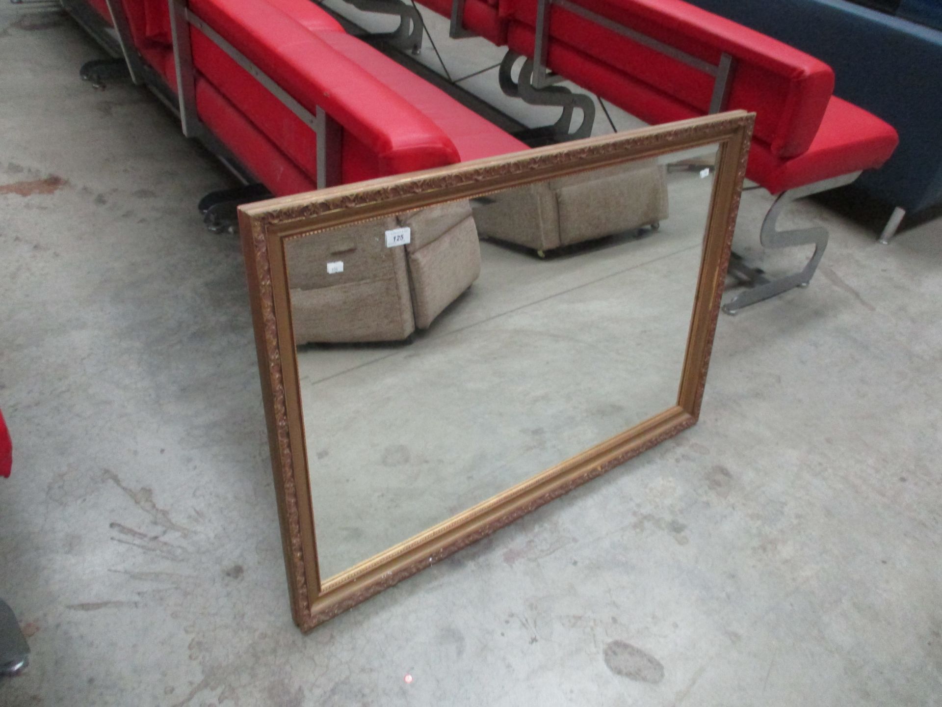 A large gilt framed wall mirror 70 x 100cm