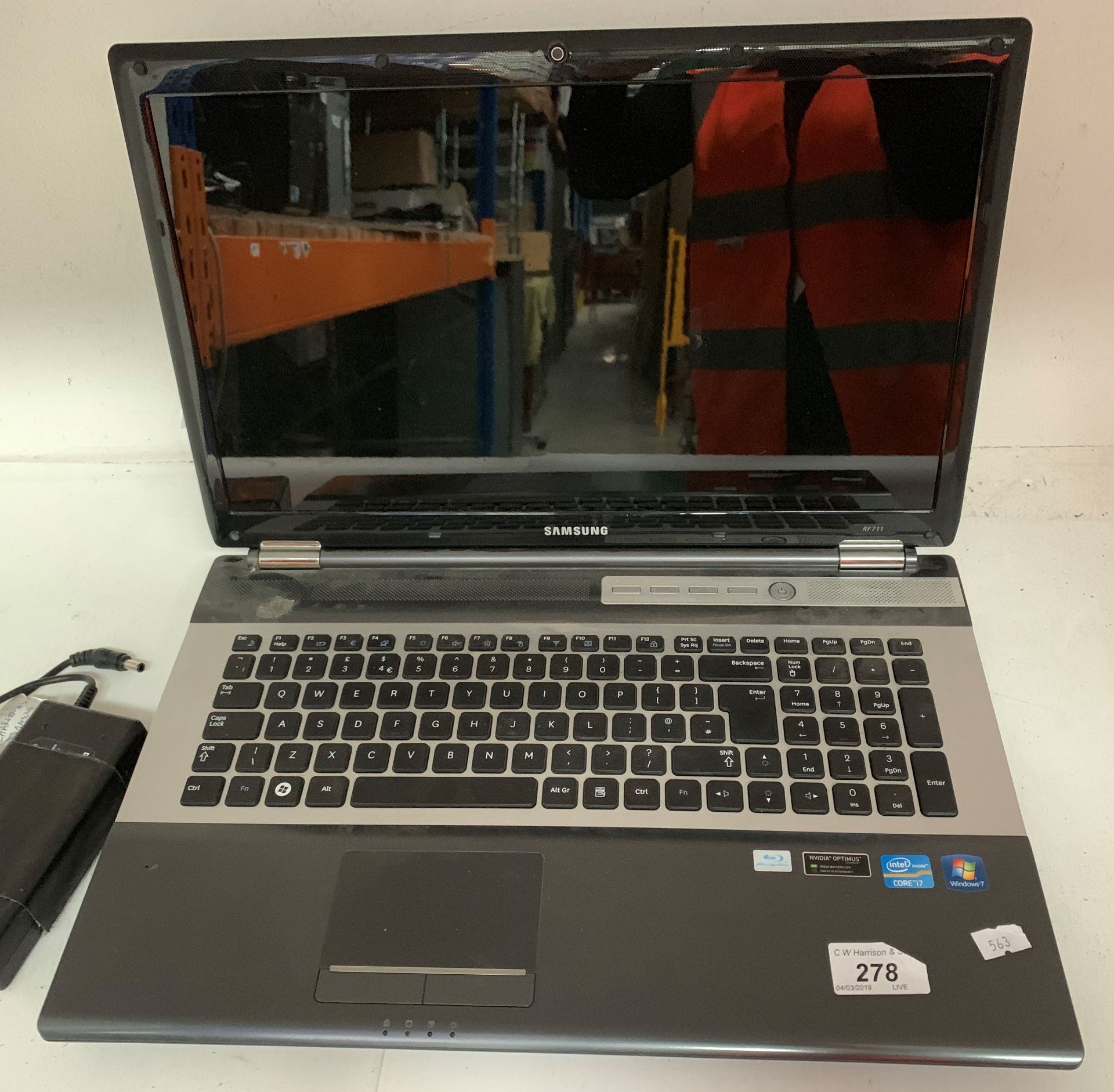 A Samsung RF711 laptop computer with power adaptor, Windows 7,