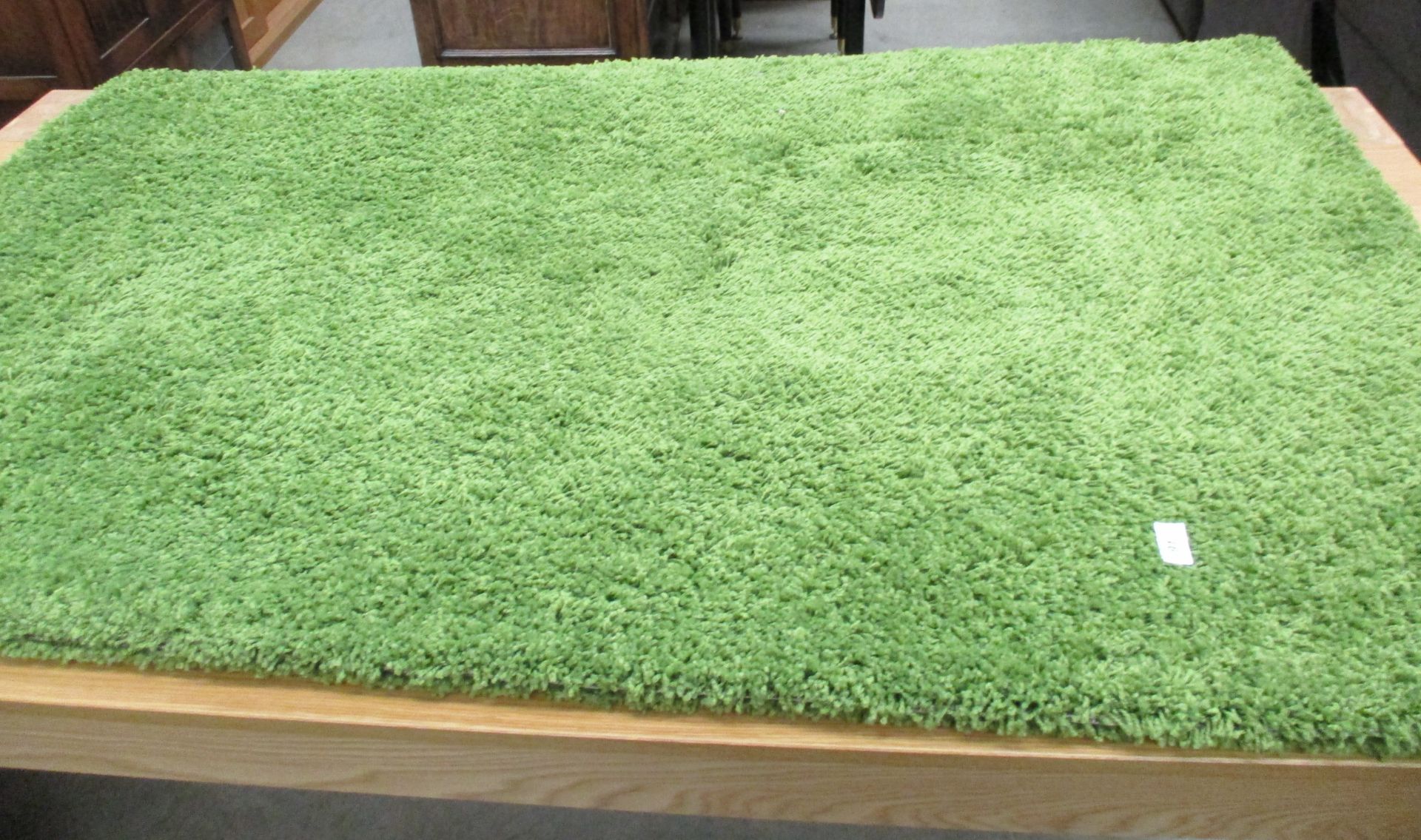 A green hessian backed rug 230 x 160cm