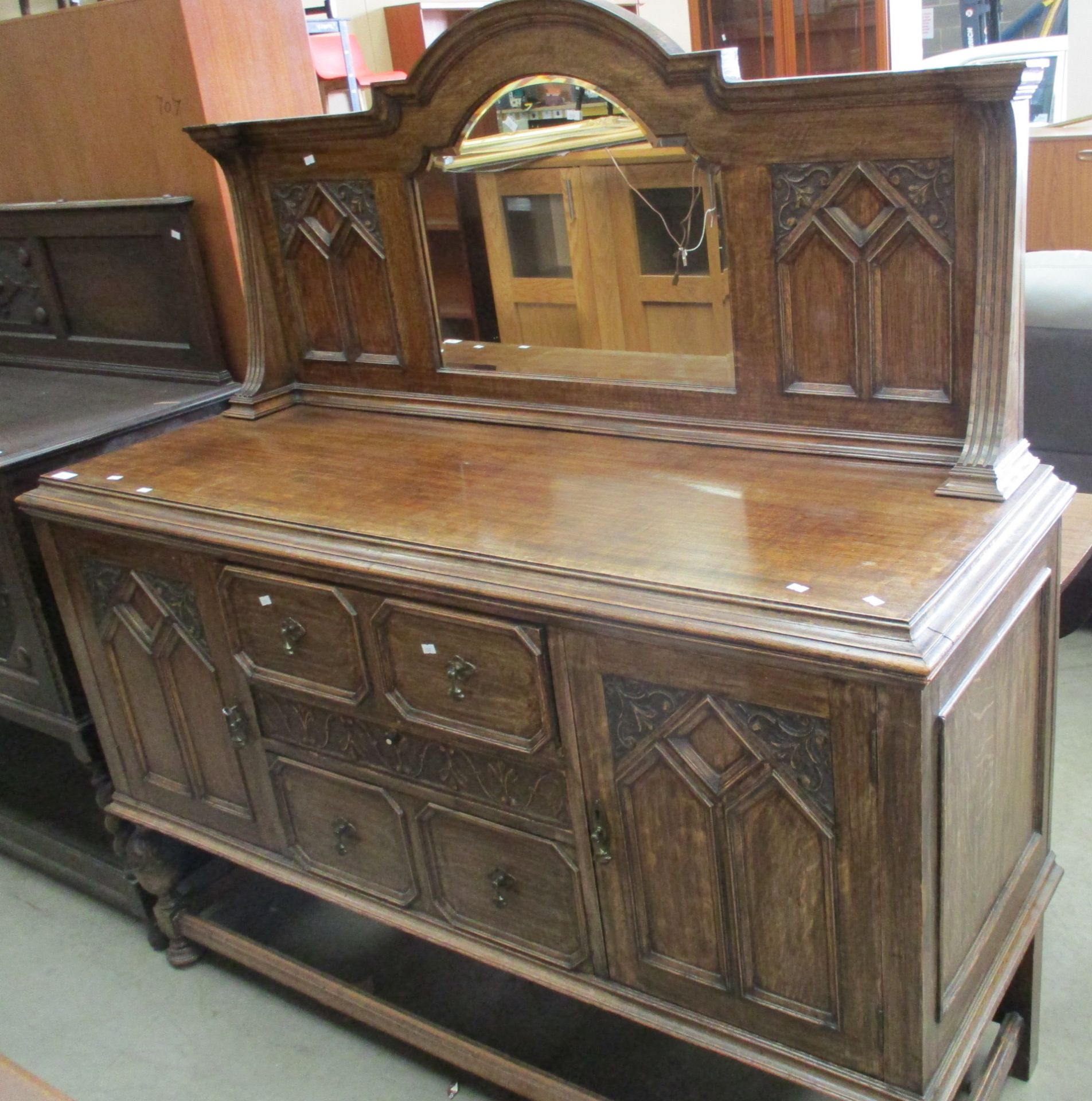 A carved oak 3 drawer 2 door sideboard with mirror back 150cm