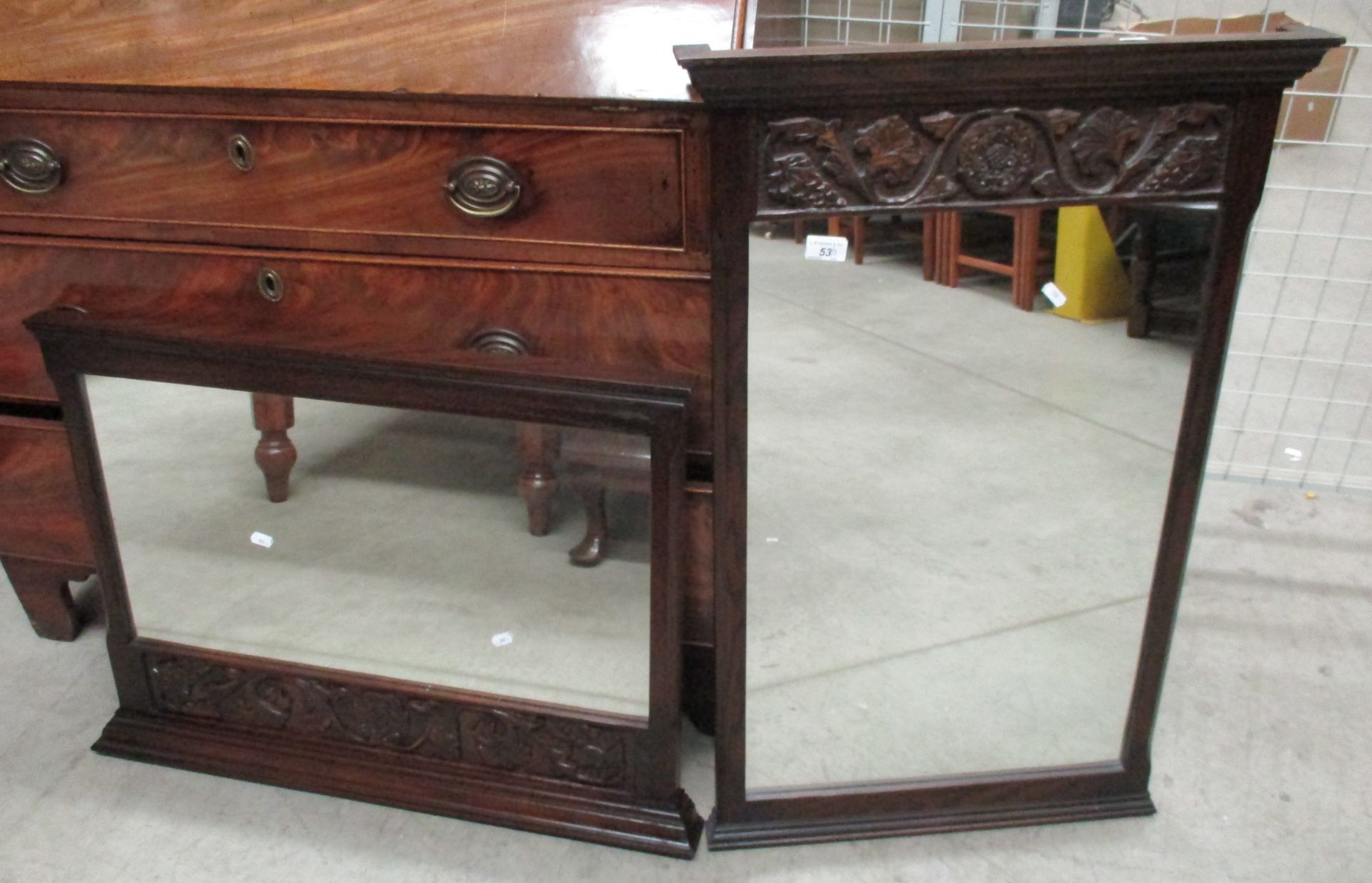 Two dark oak wall mirrors with carved decoration 1 x 92 x 60cm and 1 x 60 x 86cm