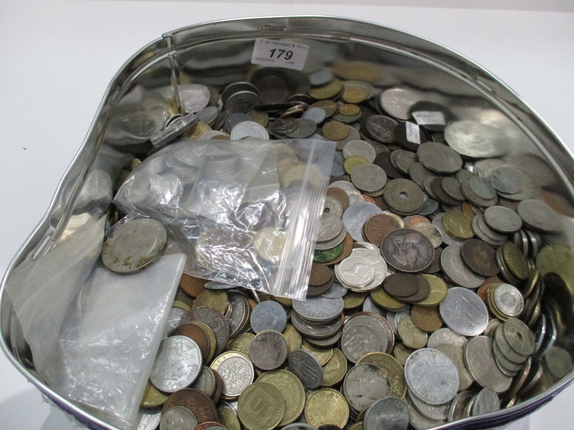 Contents to large tin - a large quantity of world coins