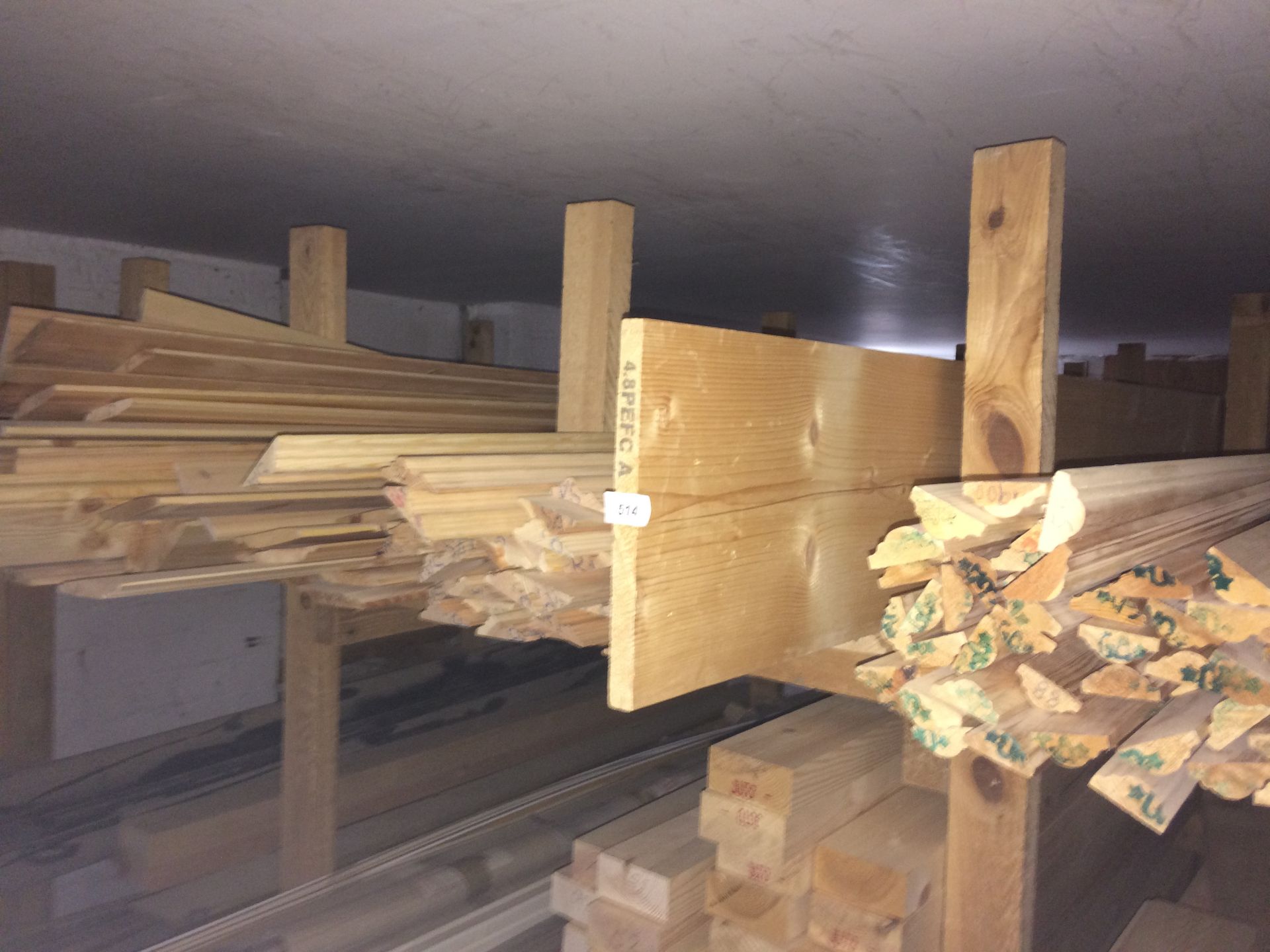 Contents to shelf - a quantity of wood picture rails,