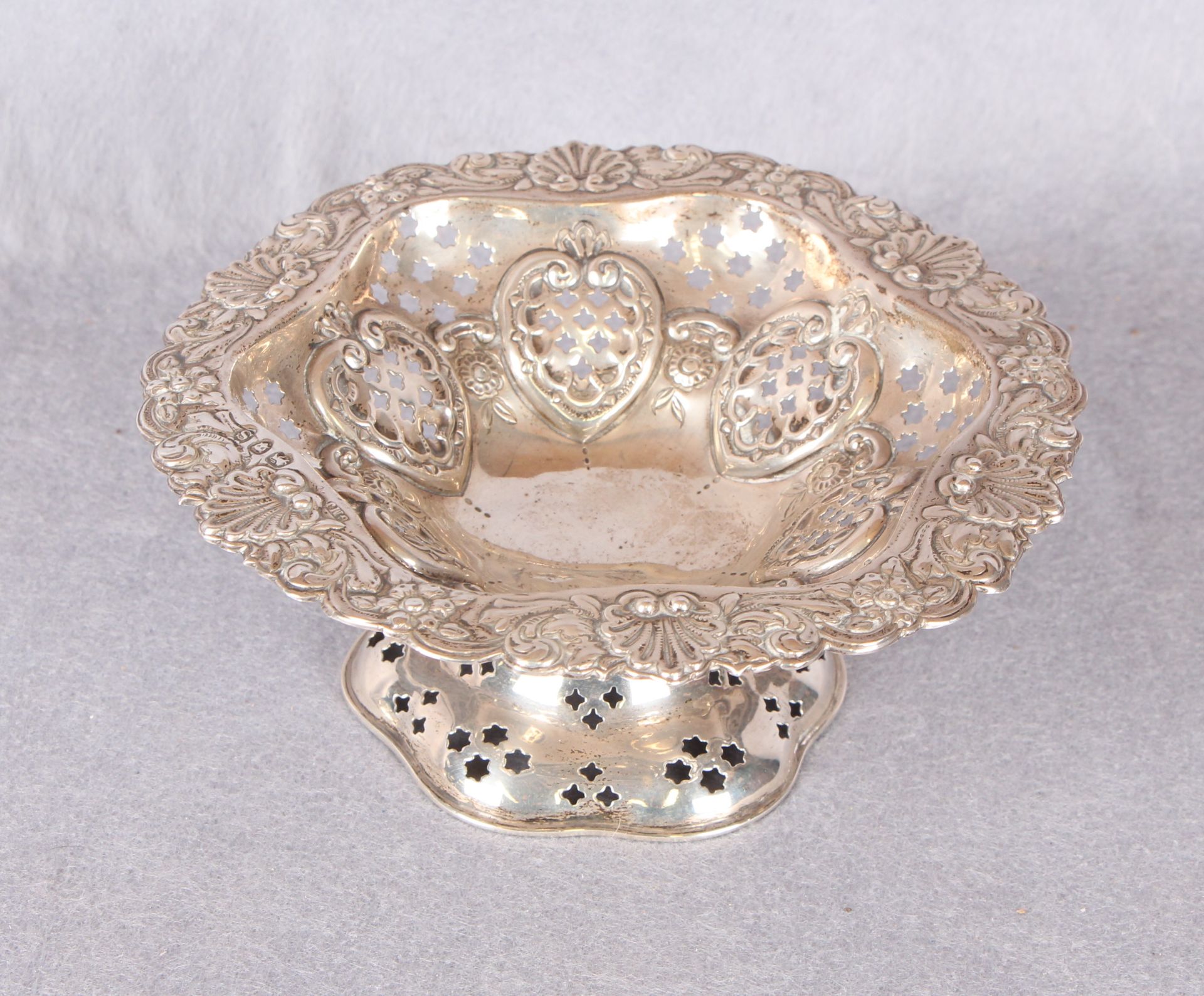 A Victorian silver pedestal dish with pierced and repoussé decoration,
