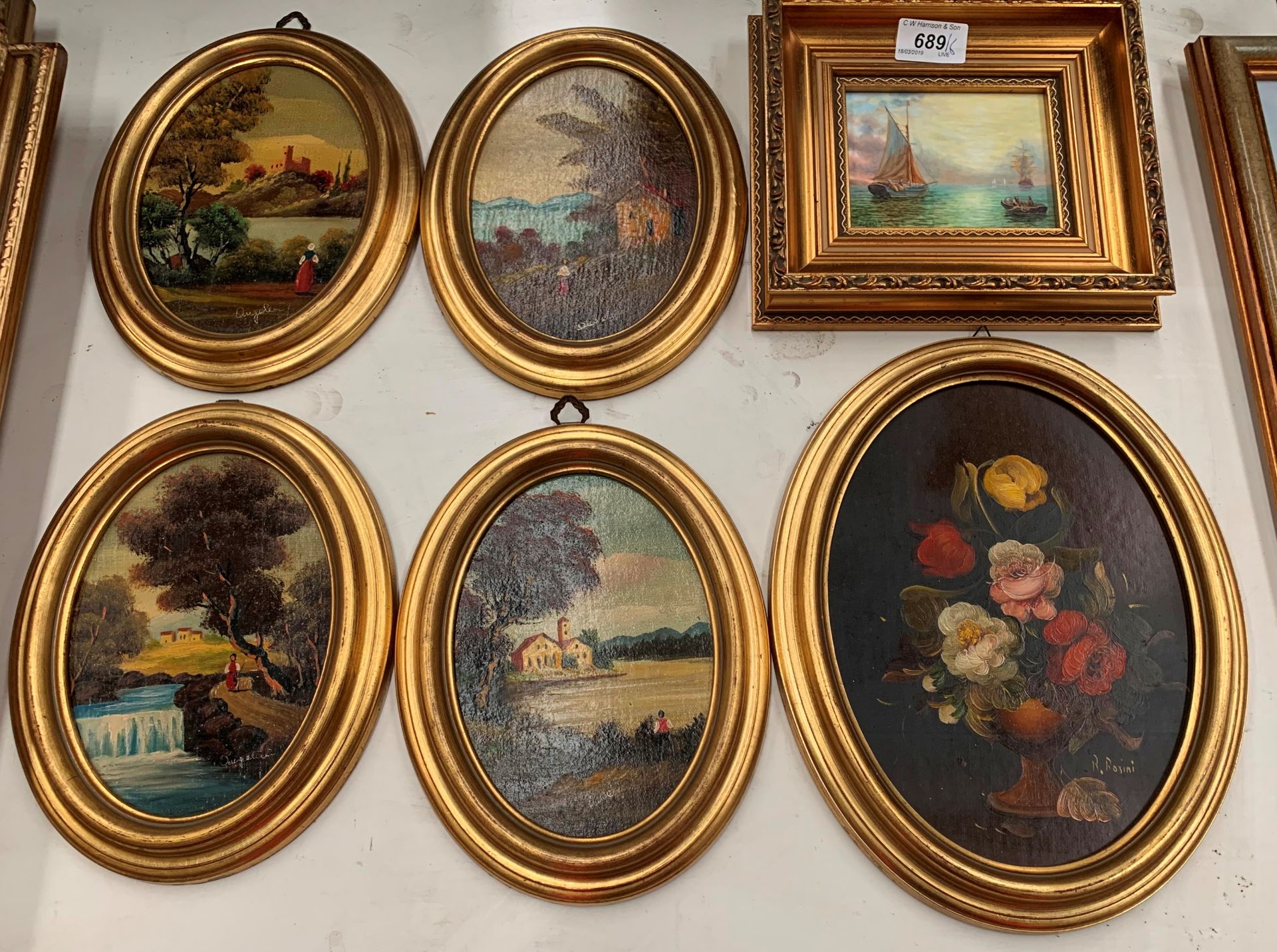 4 small oval framed Continental country scenes by Dugelicci (?), a small oval picture by R.