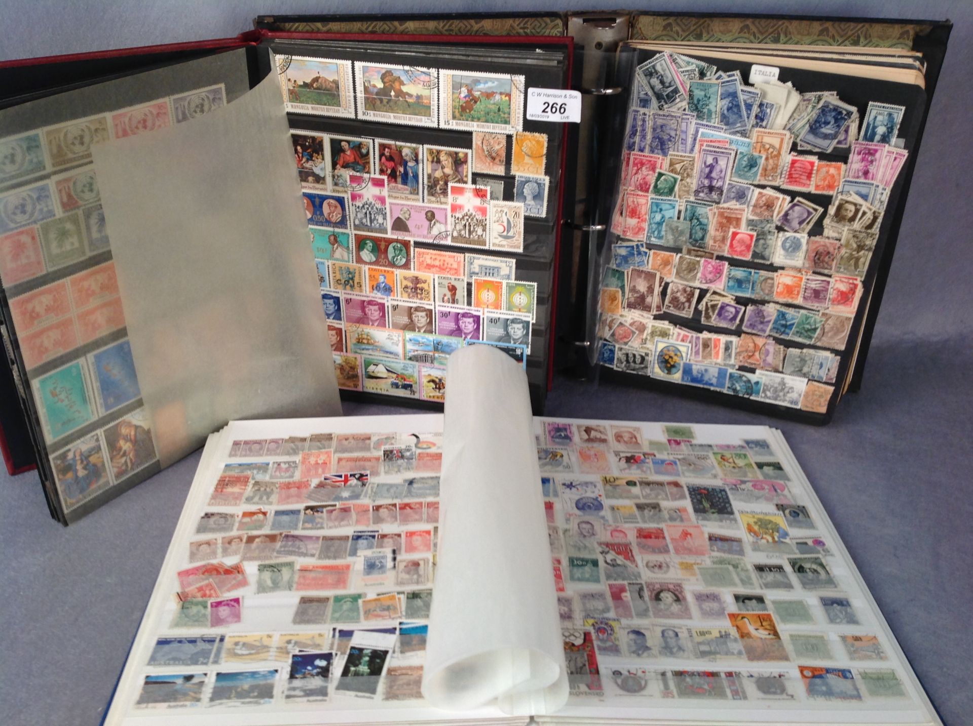 Three large stamp albums containing European and world stamps