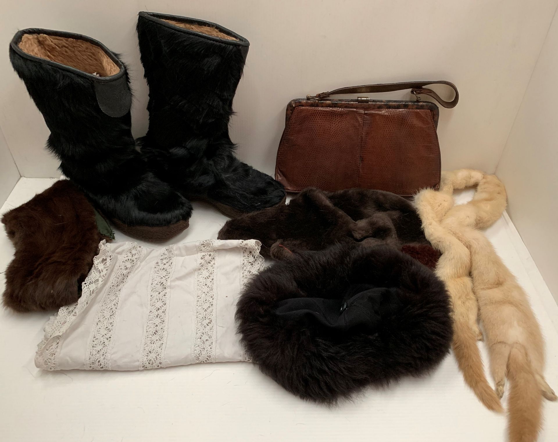 Two fur scarves, two fur hats, a pair of fur boots by Bonis,