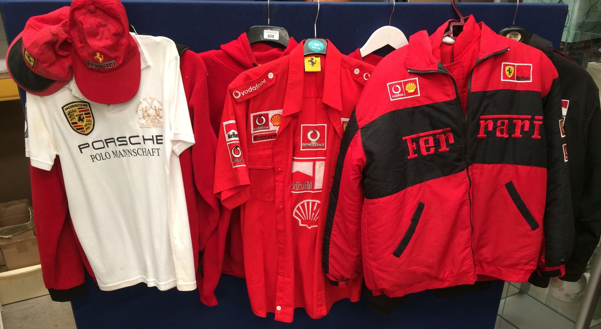 A collection of mainly Ferrari related jackets and shirts size L and M (7) and 3 baseball caps