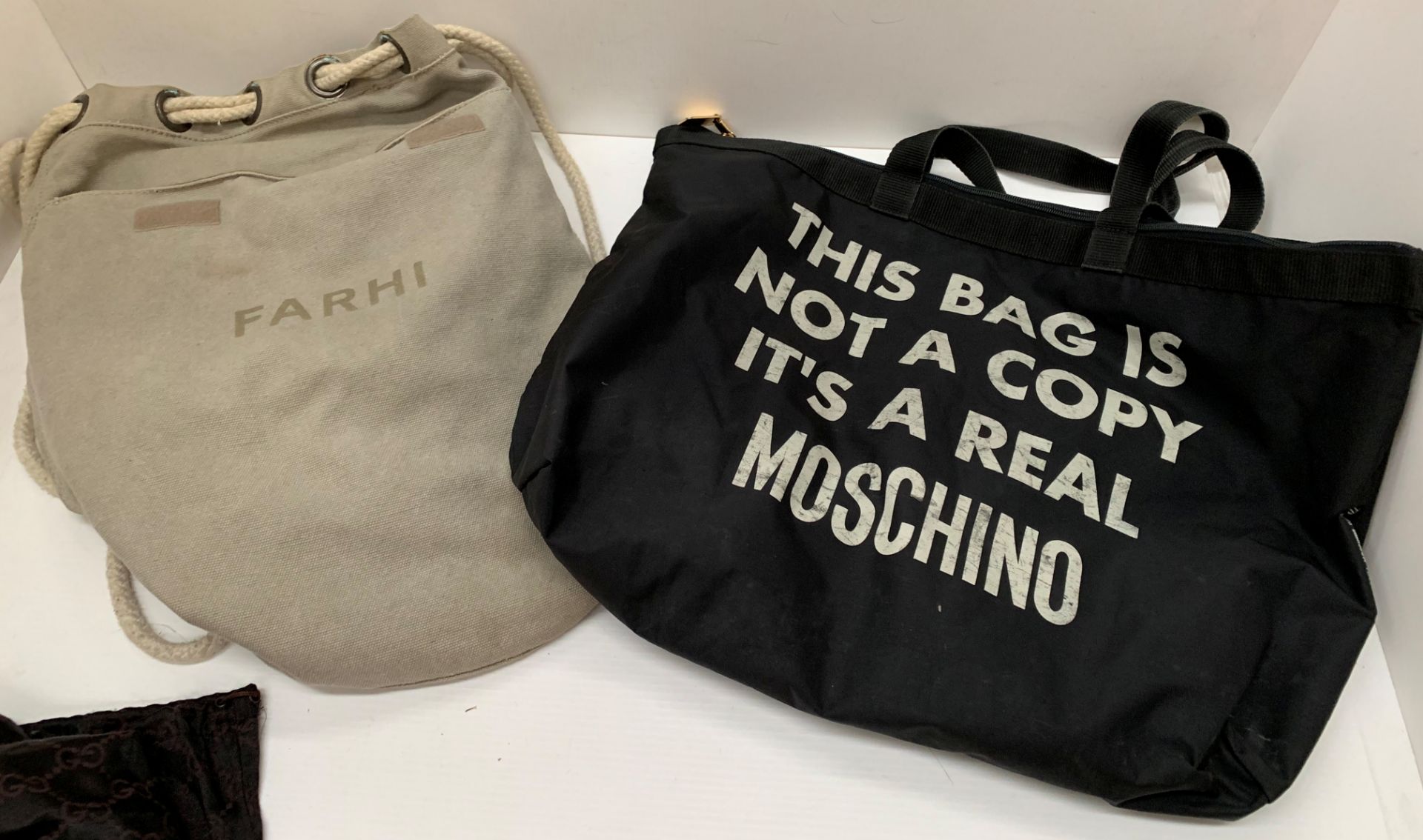 Farhi canvas duffle style bag, a black Moschino shopper, 5 x Chanel dust bags,