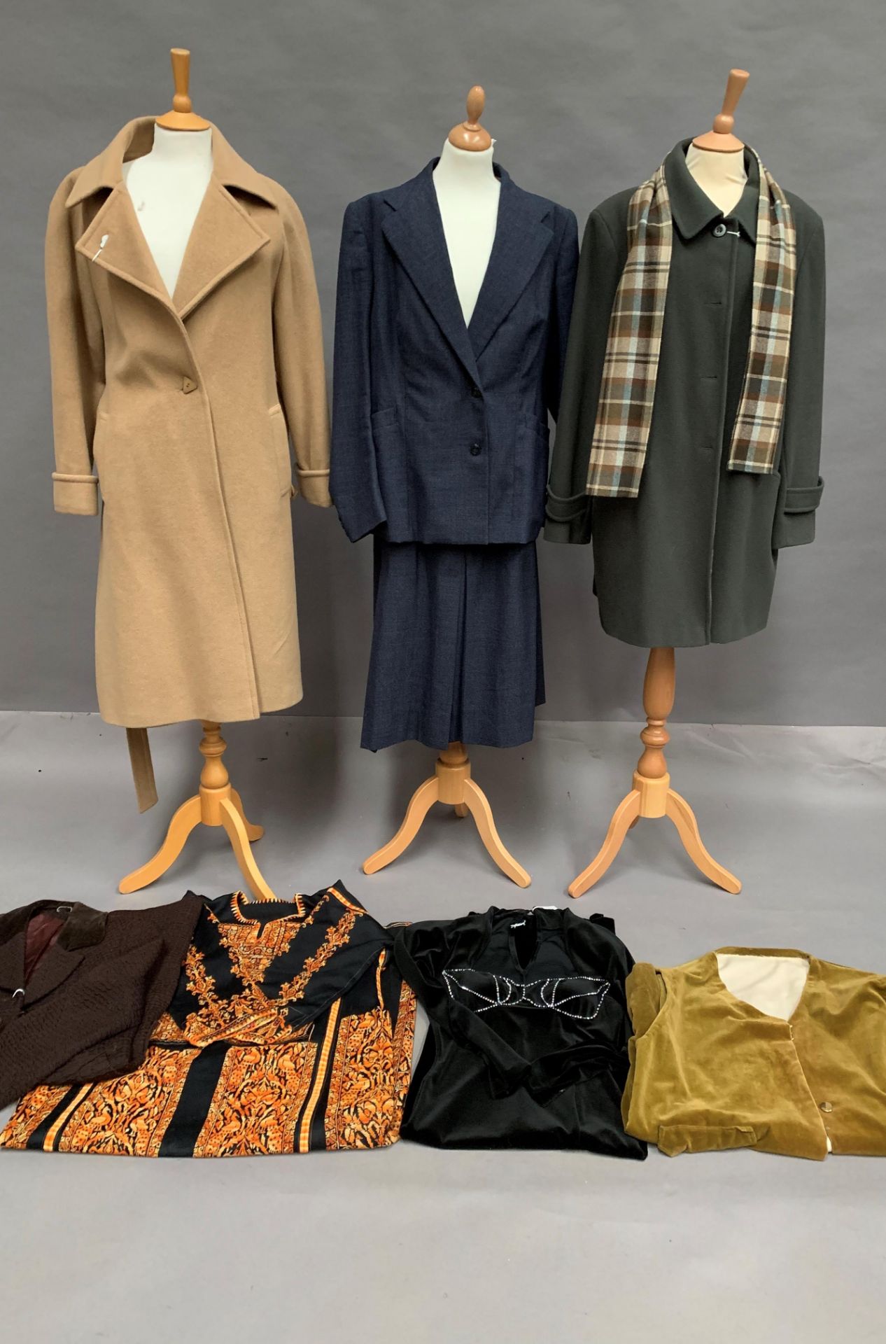 Seven items of lady's clothing - coats, suit, dresses etc.