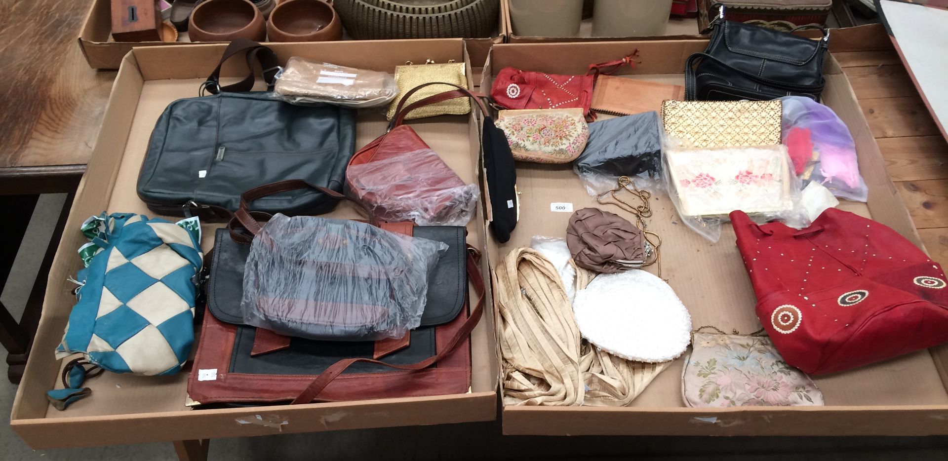 Contents to two trays - various hand bags, clutch bags, shoulder bags etc.