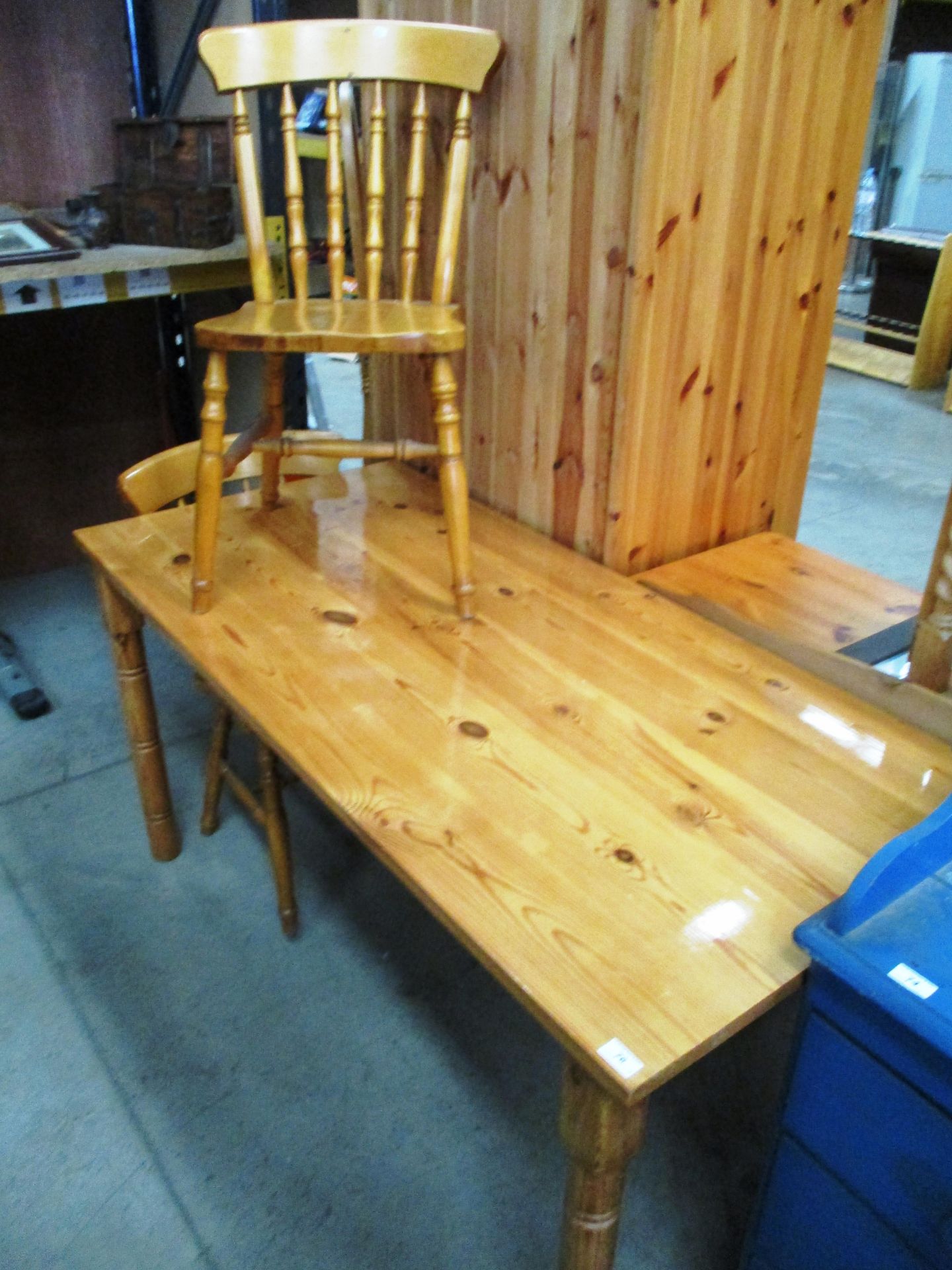 A pine dining table 73 x 152cm and 2 pine railback dining chairs (3)